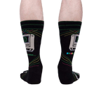 A rear view of the 'Control Alt Delete' socks on a person's legs, showcasing the sock design from behind.