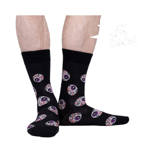 Lifestyle shot showing the glow-in-the-dark eye socks on a person's legs.