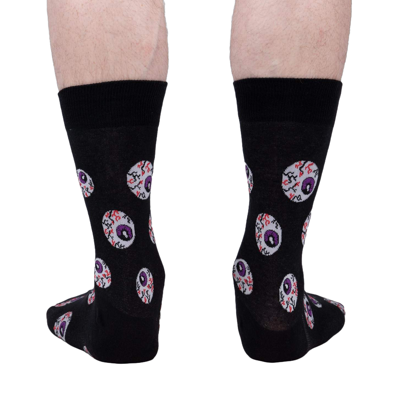 Rear view of a pair of black crew socks with an eyeball pattern.