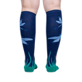 Back view of a person wearing the 'Dragonfly by Night' knee-high socks, showcasing the full design.