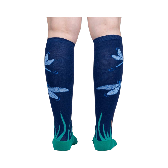 Back view of a person wearing the 'Dragonfly by Night' knee-high socks, showcasing the full design.