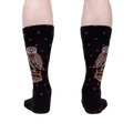 A rear view of the socks on a person's legs showing the back of the socks and the full design.