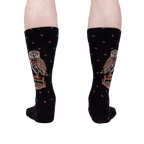 A rear view of the socks on a person's legs showing the back of the socks and the full design.