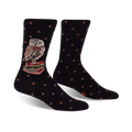 A pair of black crew socks with a red diamond pattern. A charming owl wearing a bow tie and perched on a stack of books is featured on the socks.