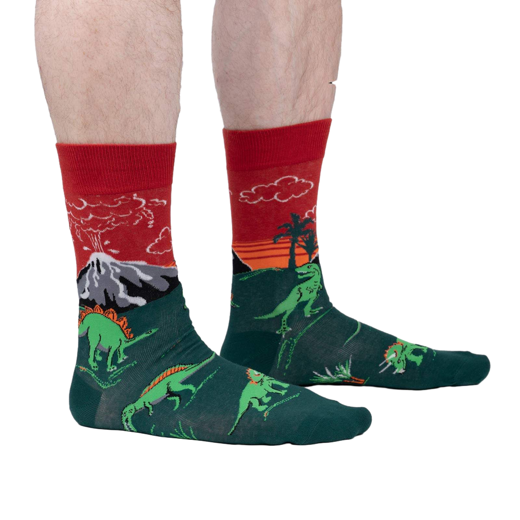Lifestyle shot of a person wearing the Dinosaur Days Glow socks, showing the socks on their legs.