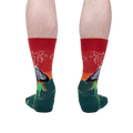 Back view of the Dinosaur Days Glow socks on a person's legs, highlighting the full design.