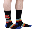 Lifestyle shot of a person wearing 'Stay Weird' socks, showing the design on the leg.