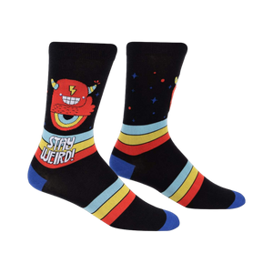 Crew socks in black with a red monster, retro stripes, and 'Stay Weird!' text.  Blue cuffs.