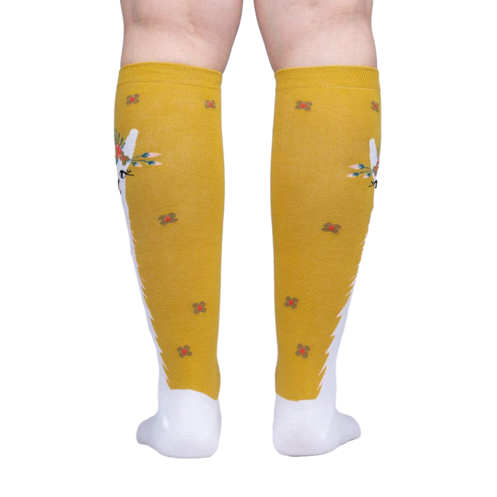 Back view of Llama Queen knee-high socks, highlighting the full design and sock placement on the leg.
