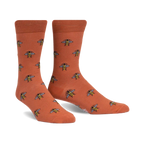 Pair of terracotta crew socks with a repeating pattern of illustrated bees. 