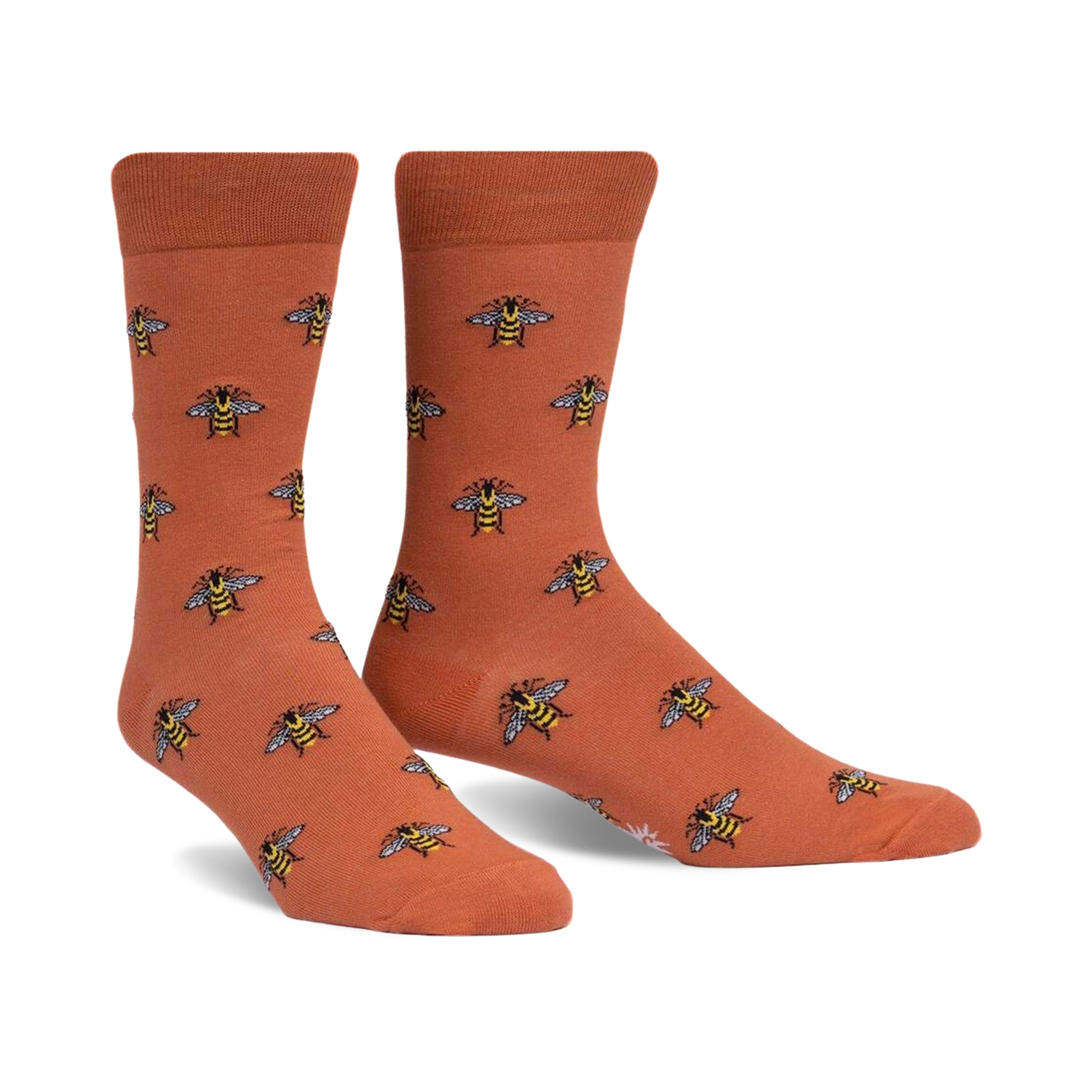 Pair of terracotta crew socks with a repeating pattern of illustrated bees. 