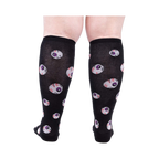 Rear view of a person wearing the All Eyes On Me Glow knee-high socks, showcasing the eyeball pattern on the back of the socks.