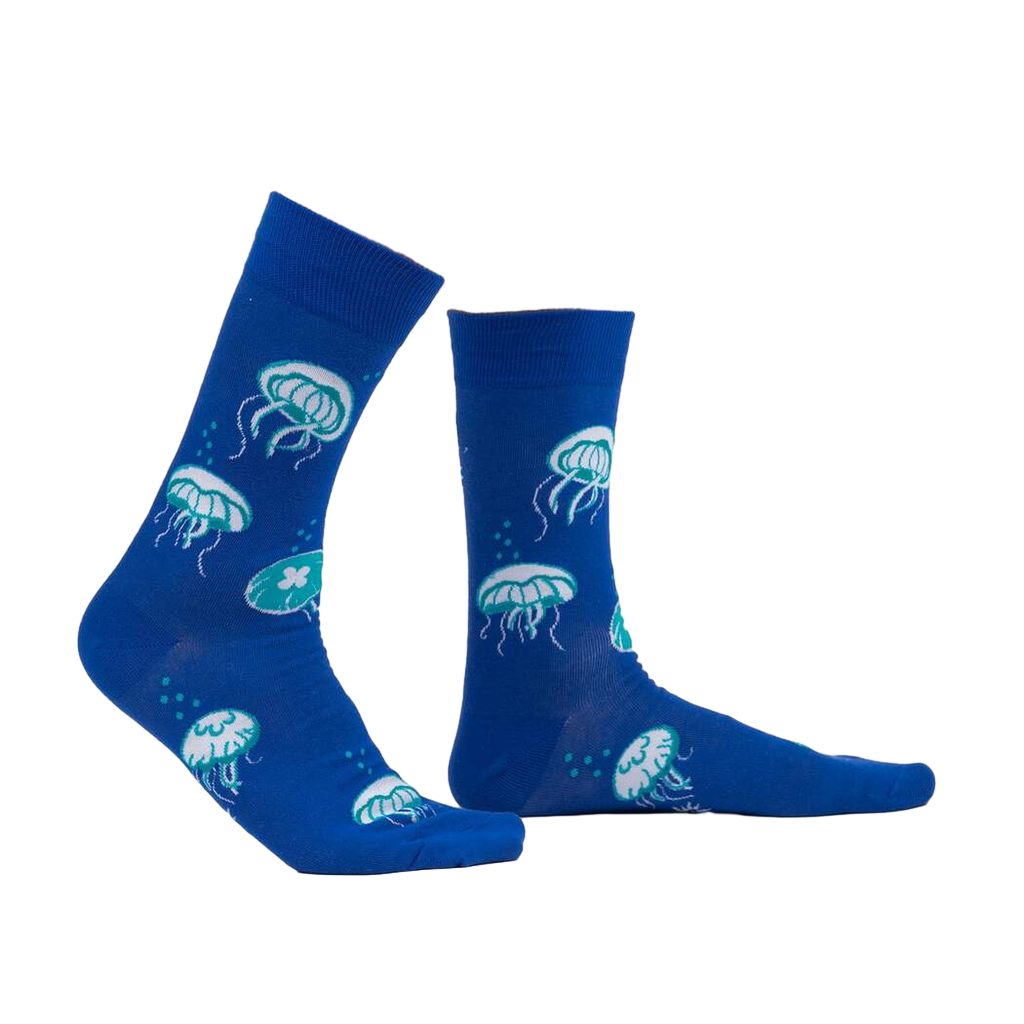 Lifestyle shot of a person wearing the 'Nice to Sea You' glow-in-the-dark jellyfish socks.