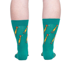 Rear view of teal crew socks with a repeating pattern of yellow chickens, showcased against a neutral gray background.