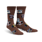 Brown crew socks with a whimsical pattern of vintage and modern cameras in colorful details.
