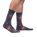 Lifestyle shot of male model wearing the 'Steaks are High' socks, showing how they look on the feet.