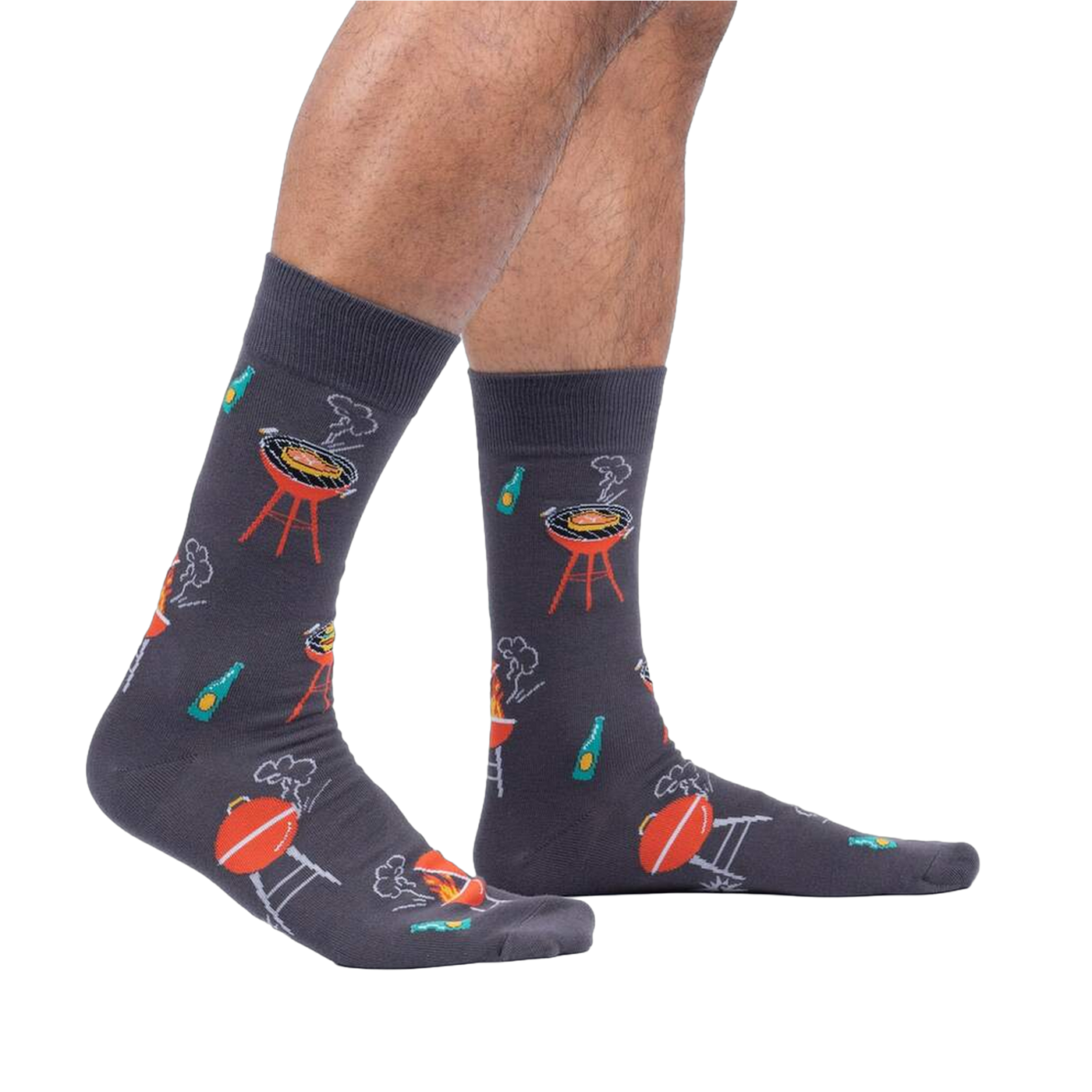 Lifestyle shot of male model wearing the 'Steaks are High' socks, showing how they look on the feet.