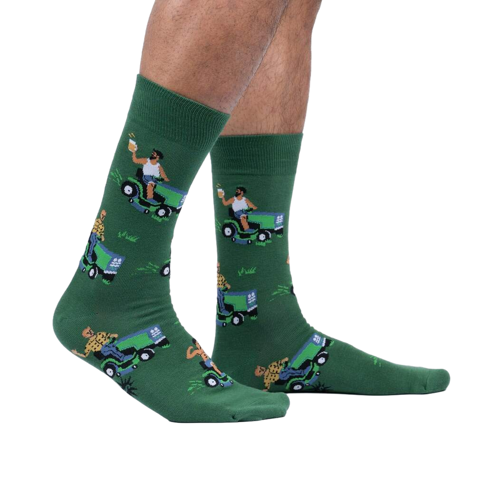Lifestyle shot of a model's legs wearing the 'My Other Car is a Lawnmower' socks. Shows how the socks look while worn.