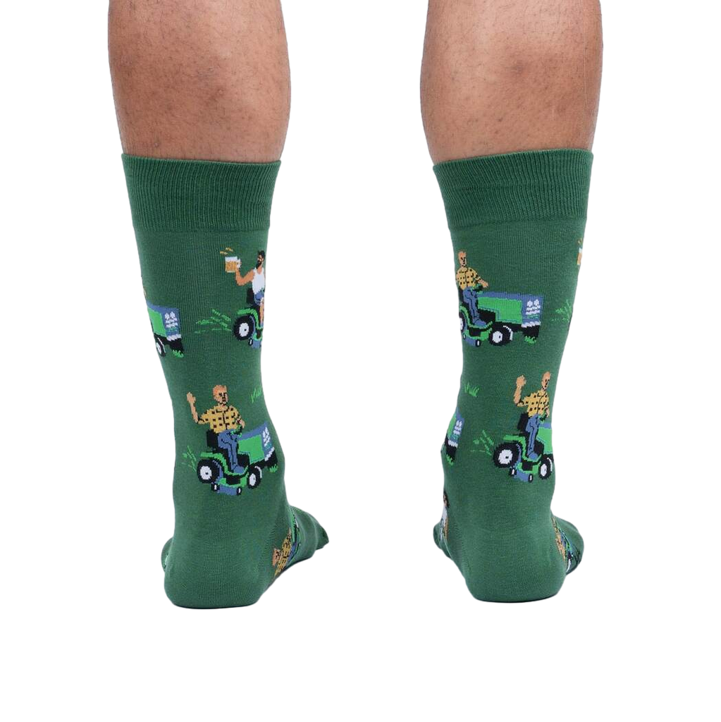 Rear view of a model wearing the 'My Other Car is a Lawnmower' socks. Provides a full view of the design on the back of the socks.
