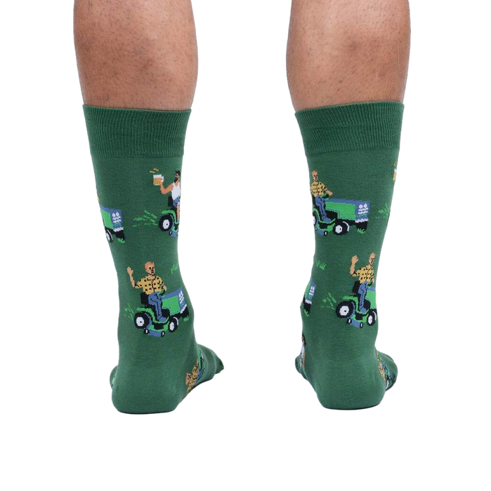 Rear view of a model wearing the 'My Other Car is a Lawnmower' socks. Provides a full view of the design on the back of the socks.