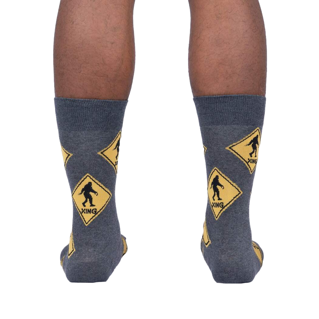 Back view of the Bigfoot Xing socks on a person's legs, showcasing the full sock design.