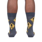 Back view of the Bigfoot Xing socks on a person's legs, showcasing the full sock design.