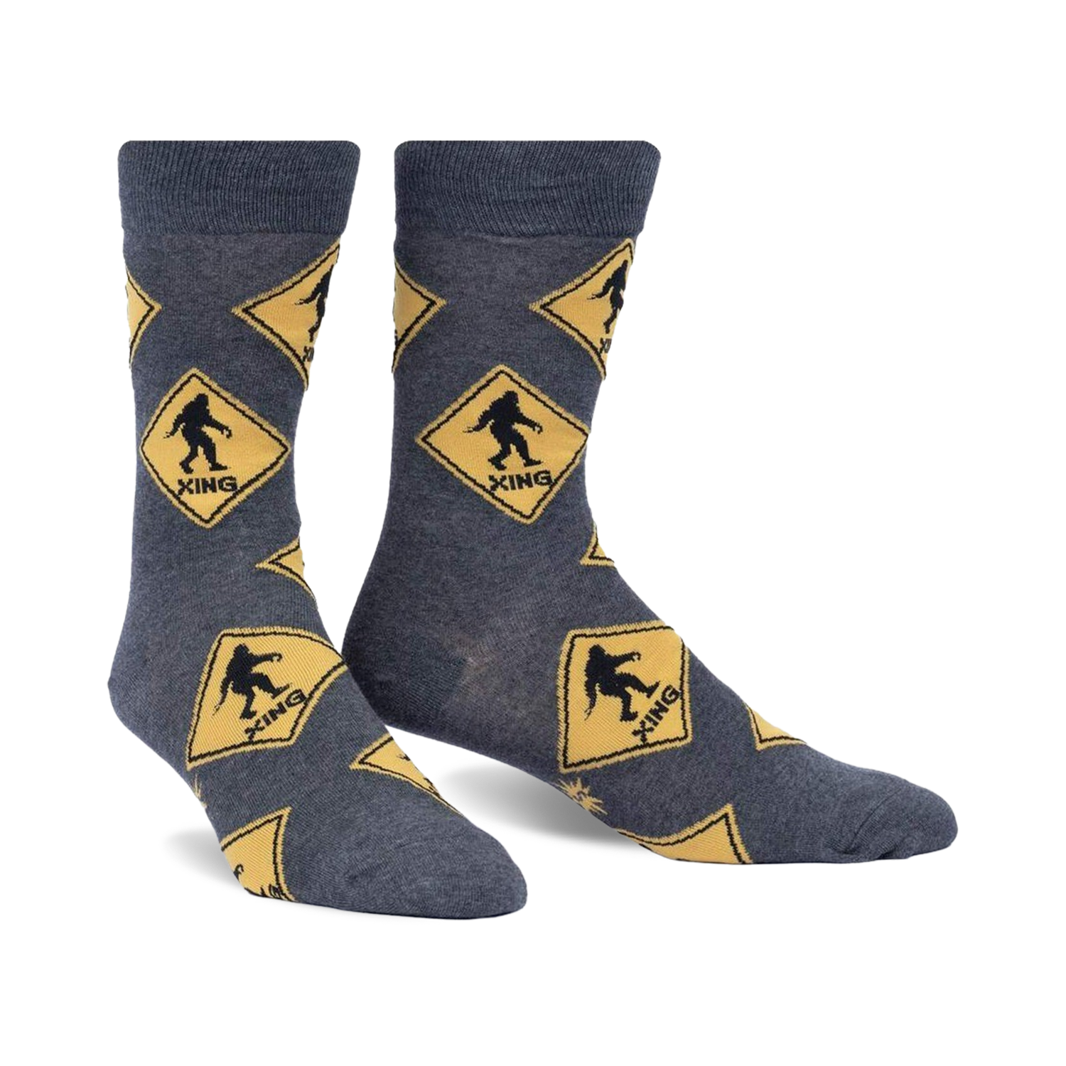 Crew socks in grey with a repeating pattern of yellow diamond-shaped Bigfoot crossing signs. Fun, quirky design.
