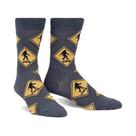 gray crew socks with yellow diamond pattern and black bigfoot silhouette inside each diamond.  