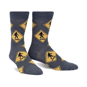 gray crew socks with yellow diamond pattern and black bigfoot silhouette inside each diamond.  