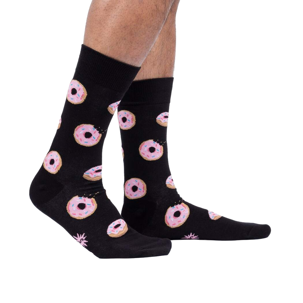 Lifestyle shot: Person wearing the Donut Stop Believing socks, showing how they look on feet.