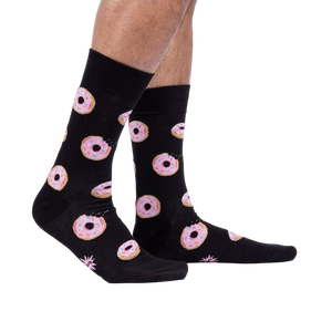 Lifestyle shot: Person wearing the Donut Stop Believing socks, showing how they look on feet.