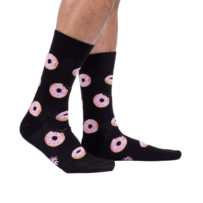 Lifestyle shot: Person wearing the Donut Stop Believing socks, showing how they look on feet.