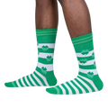 Lifestyle shot of model's legs wearing the Lucky You socks, showcasing how they look on feet.