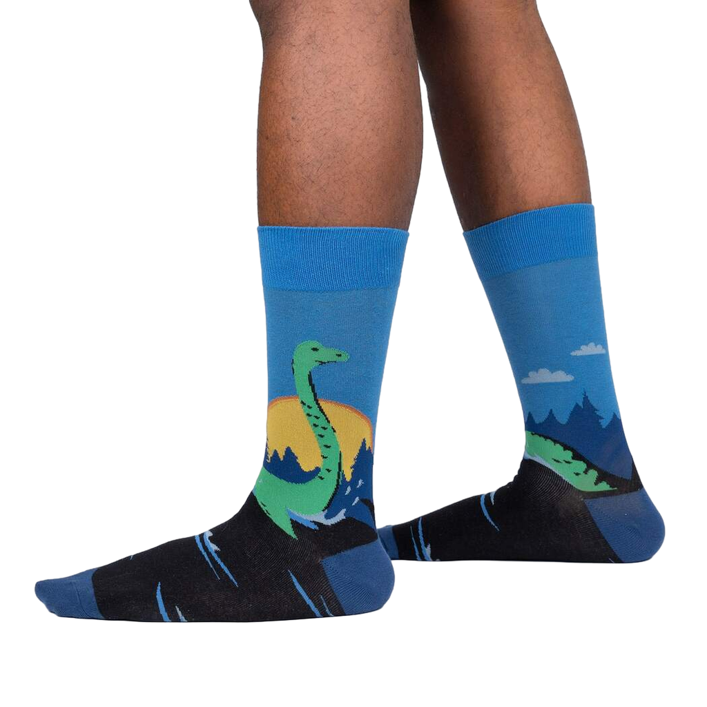 Lifestyle shot showing the Loch Ness socks on a person's legs, highlighting the fit and design on feet.