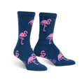 Pair of navy blue crew socks with a pink flamingo pattern.  The socks are fuzzy and feature repeating flamingo designs.