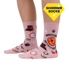 Lifestyle shot showing the 'Mercury in Retrograde' socks on a person's feet, highlighting the shimmer and fit.