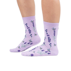 Lifestyle shot showing the socks on a person's legs against a white background.