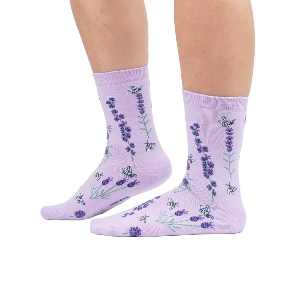 Lifestyle shot showing the socks on a person's legs against a white background.