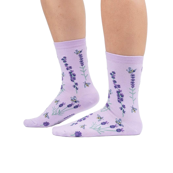 Lifestyle shot showing the socks on a person's legs against a white background.