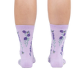 Rear view of the socks on a person's legs against a white background.