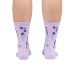 Rear view of the socks on a person's legs against a white background.