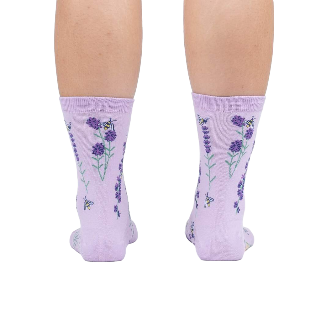 Rear view of the socks on a person's legs against a white background.