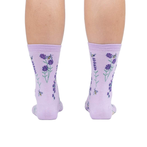 Rear view of the socks on a person's legs against a white background.