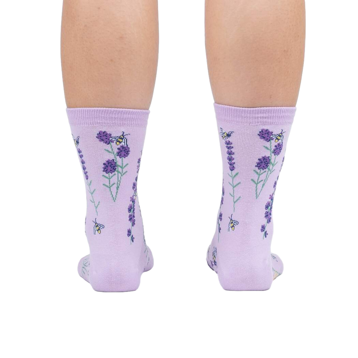 Rear view of the socks on a person's legs against a white background.