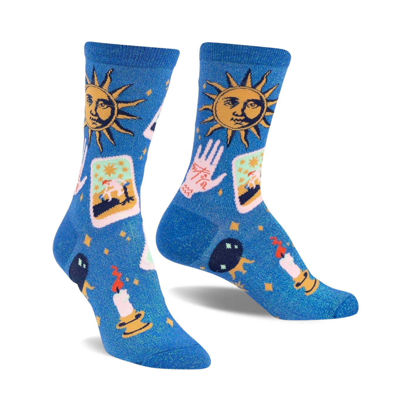 Pair of blue crew socks with a celestial design. Features suns, tarot cards, hands, candles, and crystals on a shimmering blue background.
