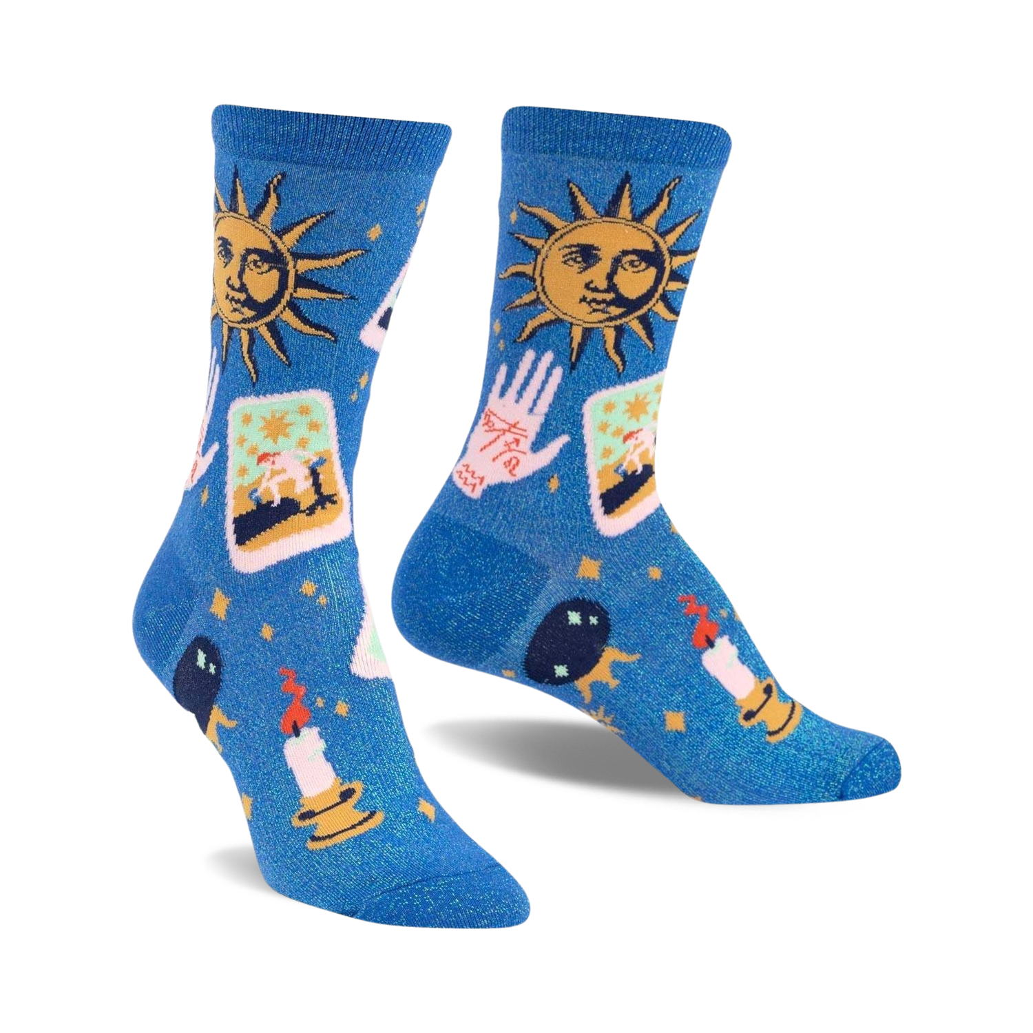 Pair of blue crew socks with a celestial design. Features suns, tarot cards, hands, candles, and crystals on a shimmering blue background.