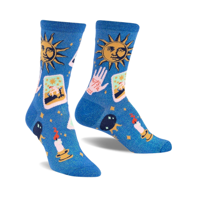 blue crew socks featuring tarot cards, a hand, the sun, a candle, and stars. funky and celestial themed.  