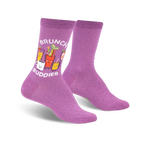 Purple crew socks with a whimsical design of cartoon brunch cocktails and the text 'Brunch Buddies'.  They have a subtle shimmer.