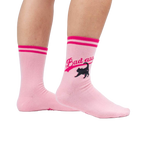 Lifestyle shot of a person wearing a pair of pink 'Bad Ass Cat' crew socks.