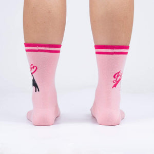 A pair of pink socks with the word 